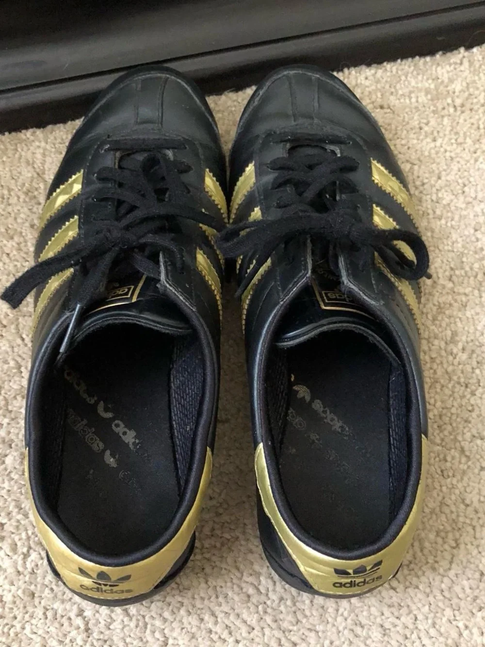 adidas Women’s Black Sneakers with Gold Stripes